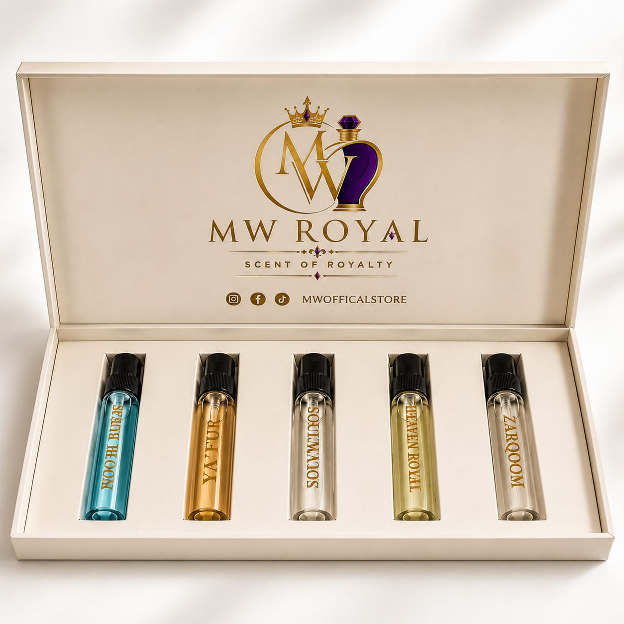 A boxed fragrance gift set from MW Royal, shown with the cream-colored presentation box open and four perfume roller bottles arranged inside. The inside lid features the MW Royal logo and branding.